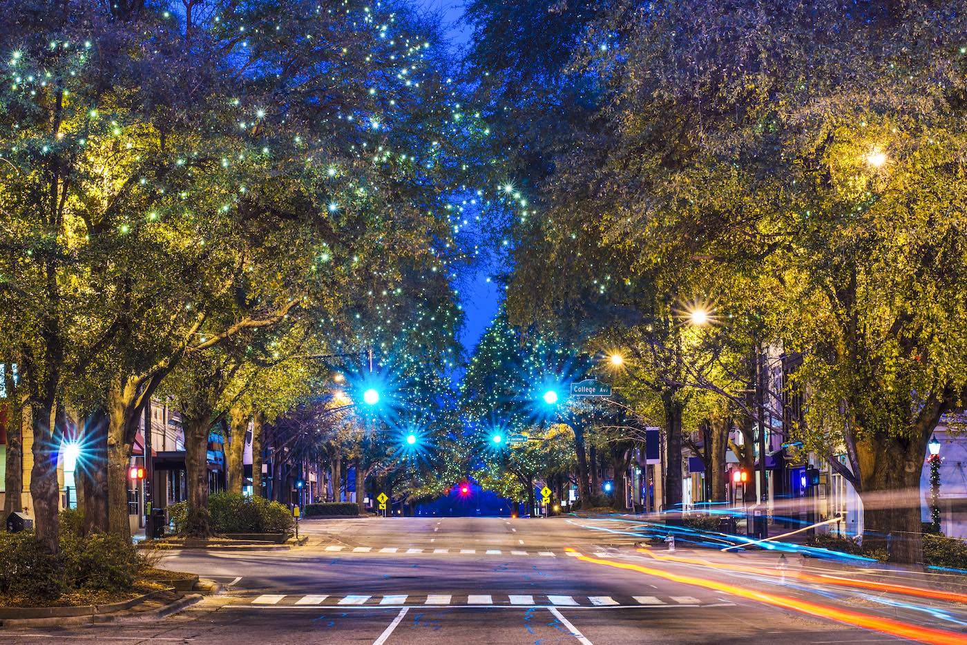 Downtown street at night in a municipality using embedded government payment software