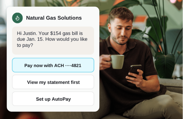 guy drinking from mug on couch with phone